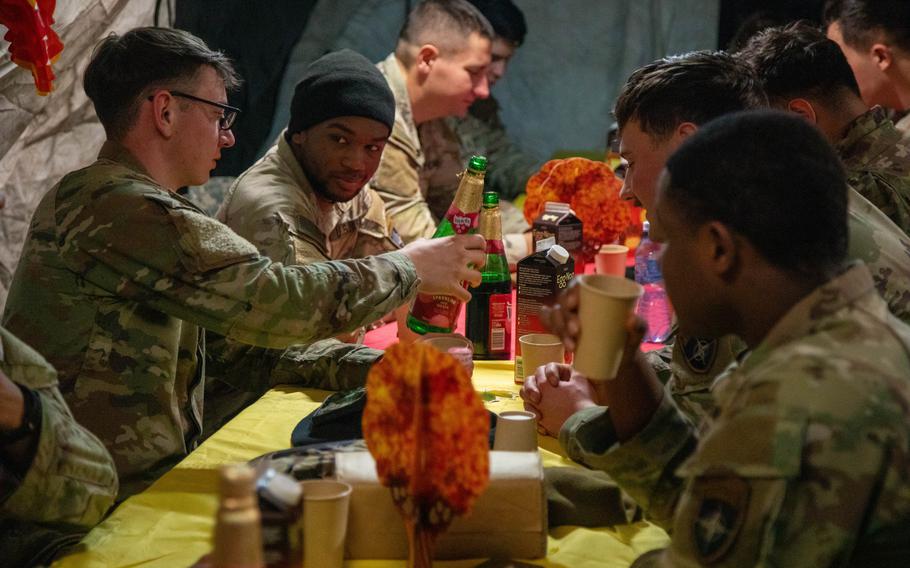 U.S. Army soldiers assigned to C-Company “Wildcards”, 2nd Battalion, 12th Regiment, 1st Armored Brigade Combat Team, 1st Cavalry Division, celebrate Thanksgiving in the field 