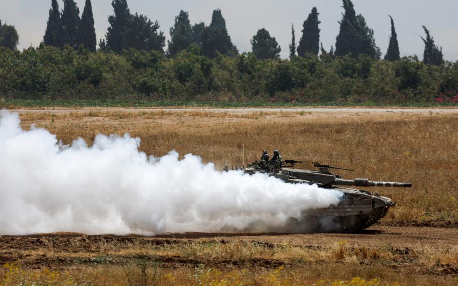 An Israeli tank maneuvers near the Israel-Gaza border amid the ongoing conflict between Israel and the Palestinian Islamist group Hamas, as seen from Israel, May 21, 2024. 