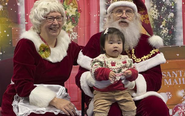 Santa and Mrs. Claus talk to a child in Yakutat, Alaska, in the Alaska National Guard's Operation Santa program, Wednesday, Dec. 18, 2024. (AP Photo/Mark Thiessen)