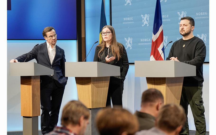 Left to right, Sweden's Prime Minister Ulf Kristersson, Iceland's Prime Minister Katrín Jakobsdottir and Ukrainian President Volodymyr Zelensky attend a briefing at the government's representative residence in Oslo on Dec. 13, 2023.