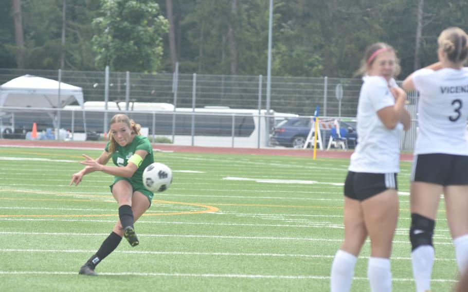 Naples' Emma Heavey sends a free kick past a wall of Vicenza defenders on the way to teammate VaNae Filer's foot in the DODEA European Division II girls soccer championship game Thursday, May 23, 2024, at Ramstein Air Base in Germany.