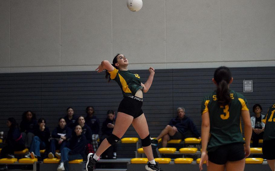 Sofia Tryon jumps to hit the ball.