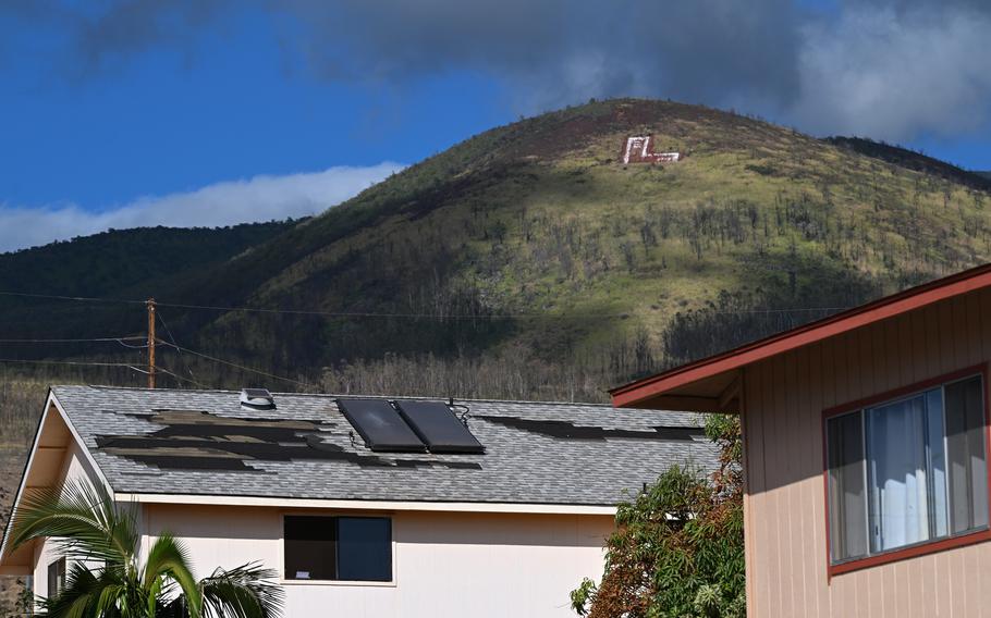 Shingles are missing from a roof in Lahaina after the wildfires that started Aug. 8.