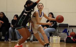 Yokota's Molly Bogdan dribbles against John F. Kennedy's Amanda Lizama.