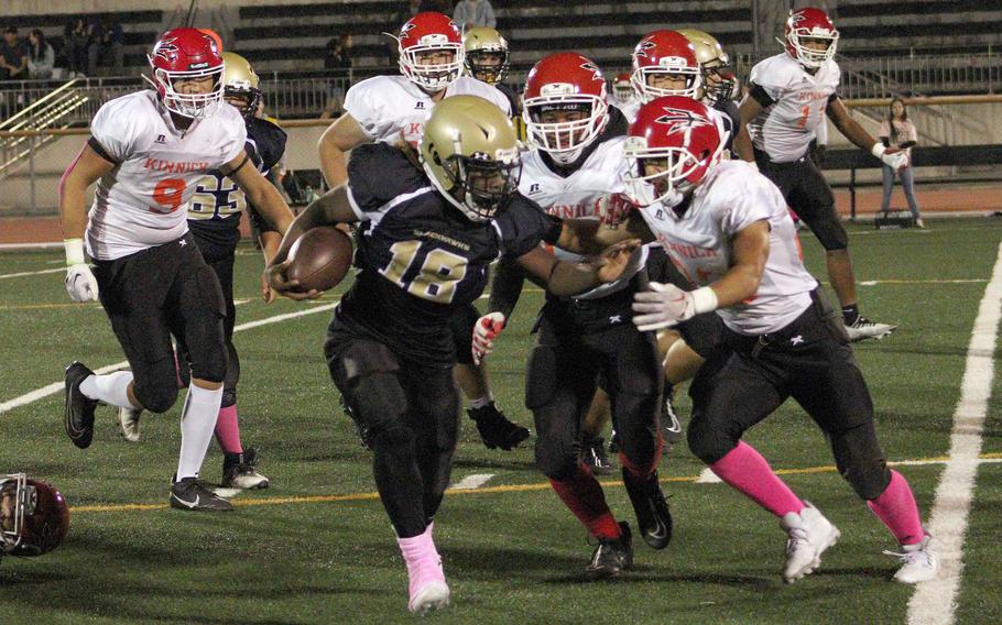 Humphreys' Joshua Canion finds himself hemmed in by Nile C. Kinnick defenders.