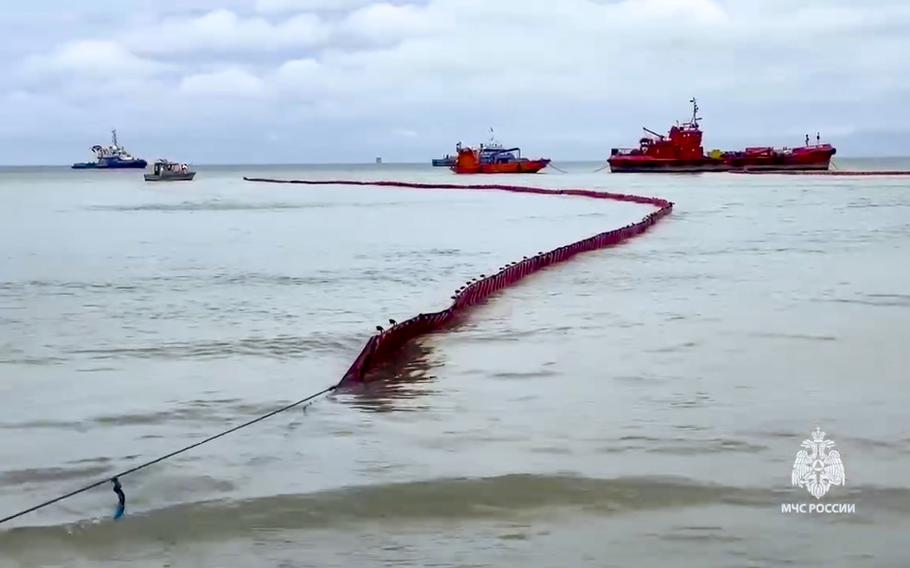 Booms are visible on the sea around the damaged Volgoneft-239 tanker near the port of Taman.