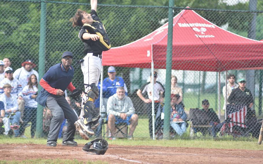 Stuttgart catcher Tyler Blalock jumped as high as he could, but he couldn't come down with an errant throw that led to two runs scoring at the DODEA European Division I championship game Friday, May 24, 2024, at Ramstein Air Base, Germany.