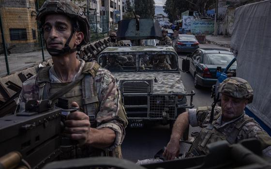 Soldiers from the Lebanese army patrol the roads around Beirut’s southern suburbs on Nov. 11. MUST CREDIT: Ed Ram for The Washington Post