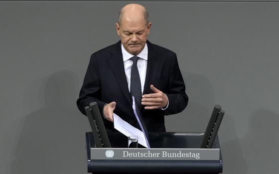 German Chancellor Olaf Scholz speaks during a plenary session at the German parliament Bundestag where he faces a vote of confidence, Berlin, Germany, Monday, Dec. 16, 2024. (AP Photo/Markus Schreiber)