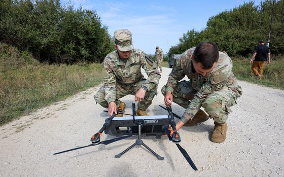 US Army soldiers handle a drone during a US military and NATO training exercise in Hohenfels, Germany, on Sept. 6. MUST CREDIT: Alex Kraus/Bloomberg