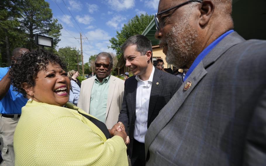 Reena Evers-Everette, left, daughter of assassinated civil rights leader Medgar Evers, left, welcomes U.S. Transportation Secretary Pete Buttigieg, second from right, Mississippi Transportation Commissioner for the Central District Willie Simmons, second from left, and U.S. Rep. Bennie Thompson, D-Miss., right, to the home of her father, assassinated civil rights leader Medgar Evers, Friday, June 21, 2024, in Jackson, Miss. 