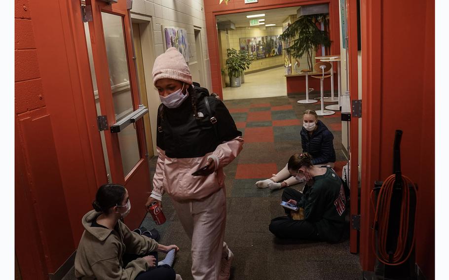 Yusbeily Vargas walks past a group of ballet students at the community center in Carbondale that is helping to support a group of Venezuelan migrants. 