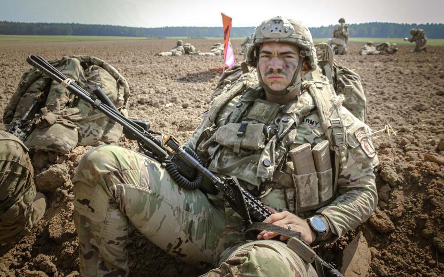 A soldier with the 173rd Airborne Brigade awaits his next task after parachuting near Joint Multinational Readiness Center Hohenfels Training Area, Germany, for Exercise Saber Junction on Sept. 4, 2024. 