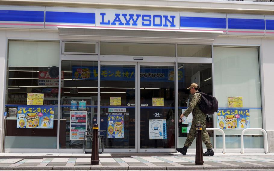 A sailor walks into a Lawson convenience store near Yokosuka Naval Base, Japan, Aug. 21, 2024.