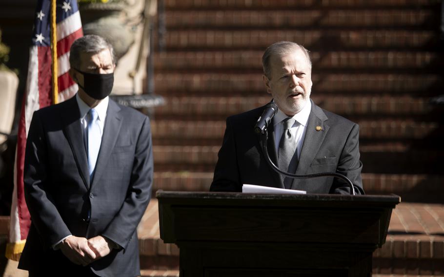 North Carolina Gov. Roy Cooper left, and state Senate leader Phil Berger, right, announces Apple’s new campus at Research Triangle Park along with House Speaker Tim Moore and other leaders from both political parties at a rare joint press conference held at the Executive Mansion in Raleigh, North Carolina on Monday, April 26, 2021. The North Carolina General Assembly approved eliminating the state’s tax on military pension income in the fiscal budget that was signed into law by Cooper in November.