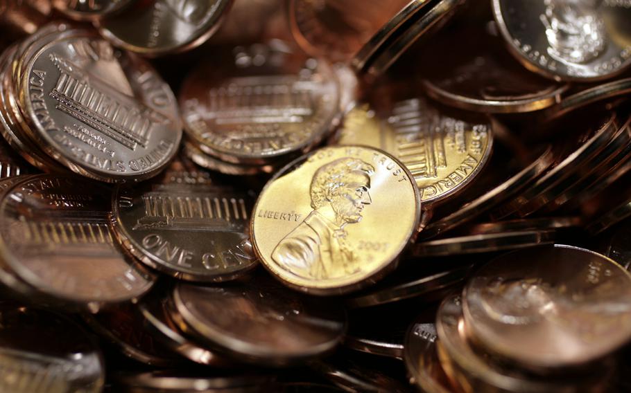 Freshly made pennies sit in a bin at the U.S. Mint in Denver on Aug. 15, 2007. 