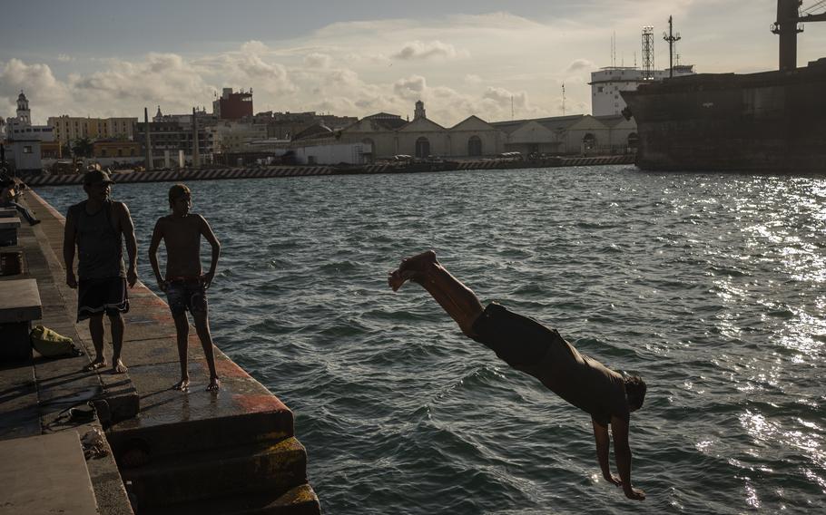Pedro Murillo, a diver, jumps into the sea amid the heat in Veracruz, Mexico, Saturday, June 15, 2024. 