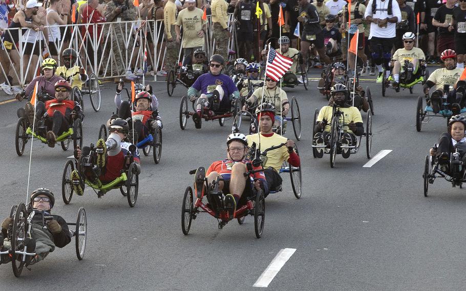 A group of disabled competitors riding bikes