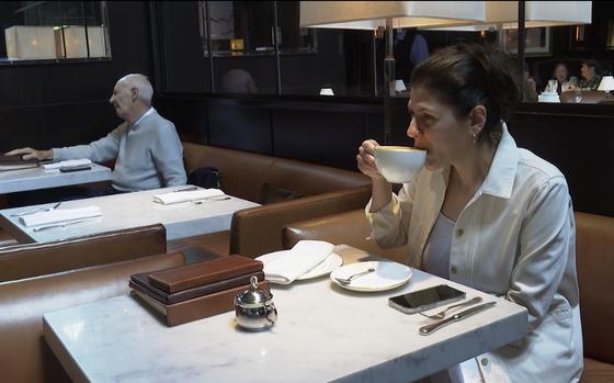 Parisa Imanirad, a scientist and cancer researcher, eats lunch alone at Spruce, an upscale restaurant in San Francisco, on Aug. 22. Imanirad, who is married and has a wide circle of friends, said dining alone gives her time to think or read. She tries not to touch her phone and relishes the silence. “It’s like a spa, but a different type,” she said.