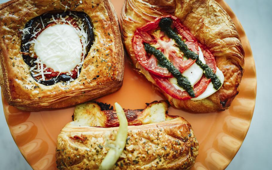 A Caprese Danish, pain Suisse and eggplant Parmesan Danish.