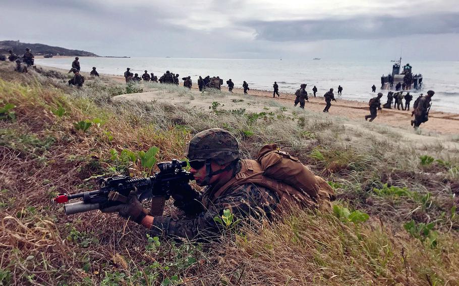 U.S. Marines secure an Australian beach during an amphibious drill.