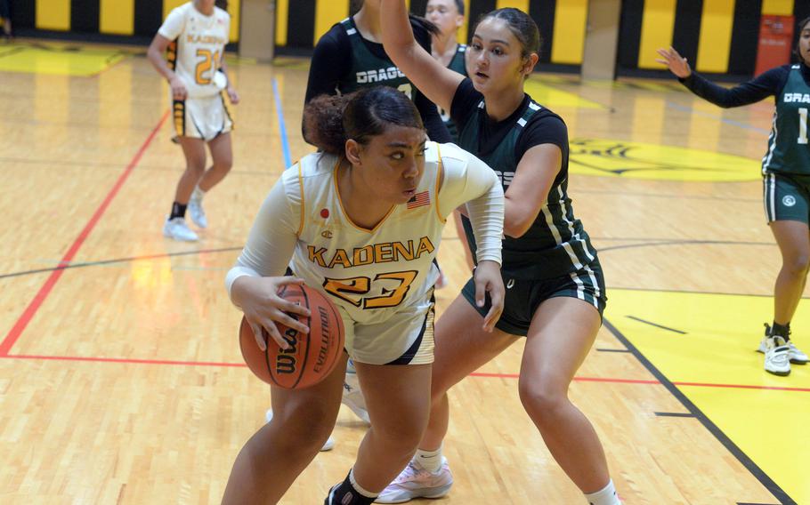 Reina Ohene dribbles toward the basket.