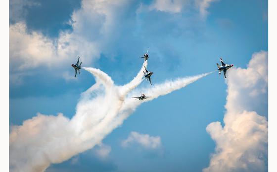 Air Force Thunderbirds pilots perform a group aerial maneuver during an air show performance at Dayton International Airport, Ohio, July 22, 2023. 