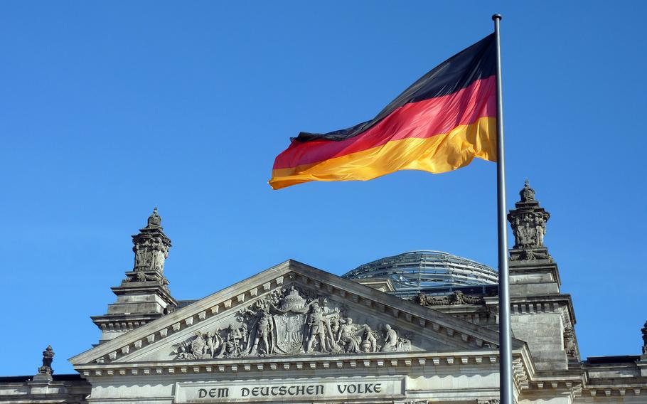 German flag flies over parliament building in Berlin