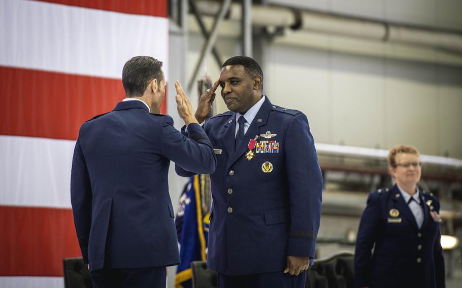 Brig. Gen. Otis Jones salutes Maj. Gen. Paul Moga upon receiving the Legion of Merit award May 17, 2024, during his official transfer of command of the 86th Airlift Wing at Ramstein Air Base, Germany. Jones served as the wing's commander since July 2022.