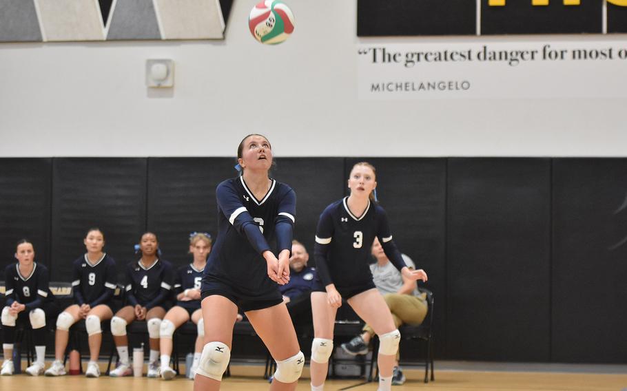 Black Forest Academy's Hannah Kooiman tracks the ball coming down towards her while teammate Leah McKell looks on Friday, Sept. 13, 2024, in the Falcons' victory over Naples in Vicenza, Italy.