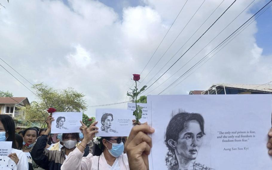 Demonstrators hold papers printed with Aung San Suu Kyi’s famous quote ''The only real prison is fear, and the only real freedom is freedom from fear'' as they rally to mark her 79th birthday in Launglon township in Tanintharyi region, Myanmar, Wednesday, June 19, 2024. 