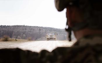 U.S. soldiers drive in a convoy.