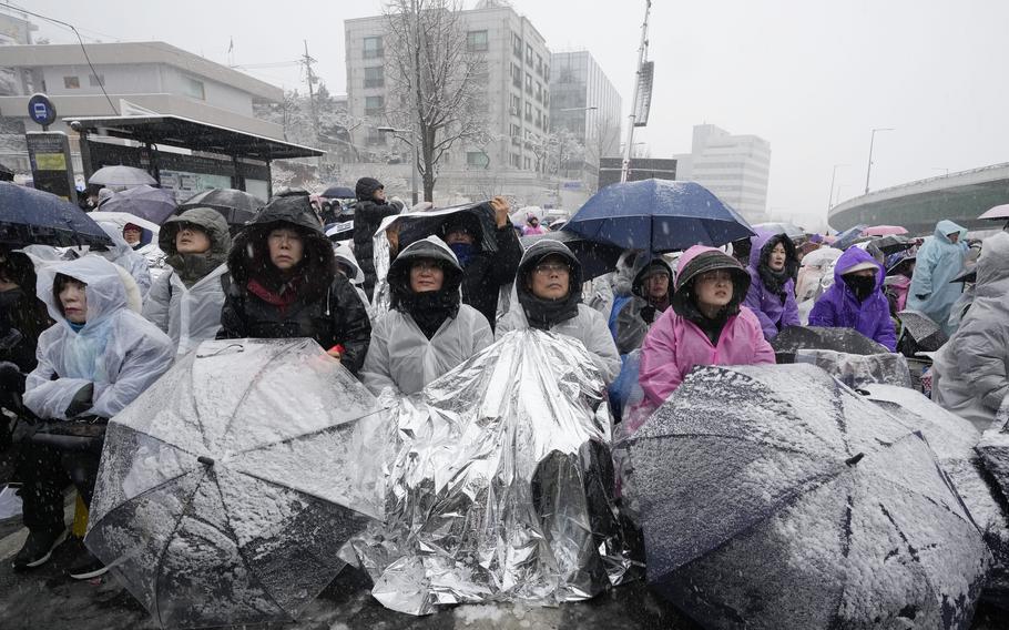 Supporters of impeached South Korean President Yoon Suk Yeol attend a Sunday service as they gather to oppose his impeachment near the presidential residence in Seoul, South Korea, Sunday, Jan. 5, 2025.