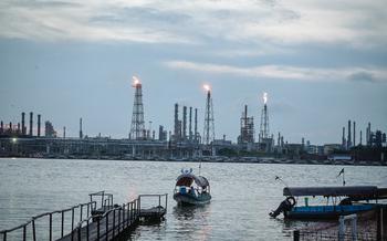 A boat passes the Francisco I. Madero oil refinery in Pueblo Viejo, Veracruz state, Mexico, on July 9, 2024. 