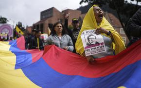 Demonstrators march against the government of President Gustavo Petro, in Bogotá, Colombia, Saturday, Nov. 23, 2024. (AP Photo/Ivan Valencia)