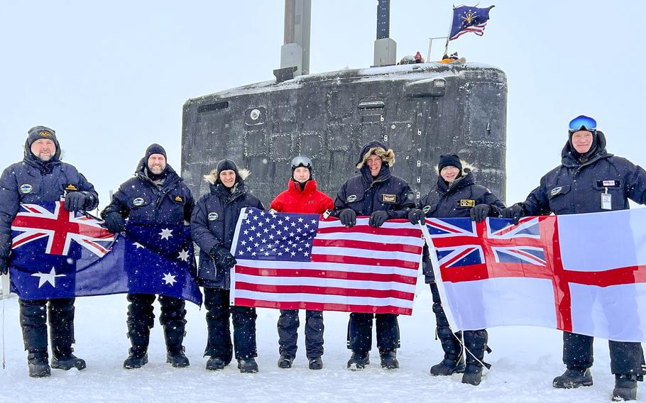 Australian, American, and British personnel near the surfaced USS Indiana during Operation Ice Camp 2024.