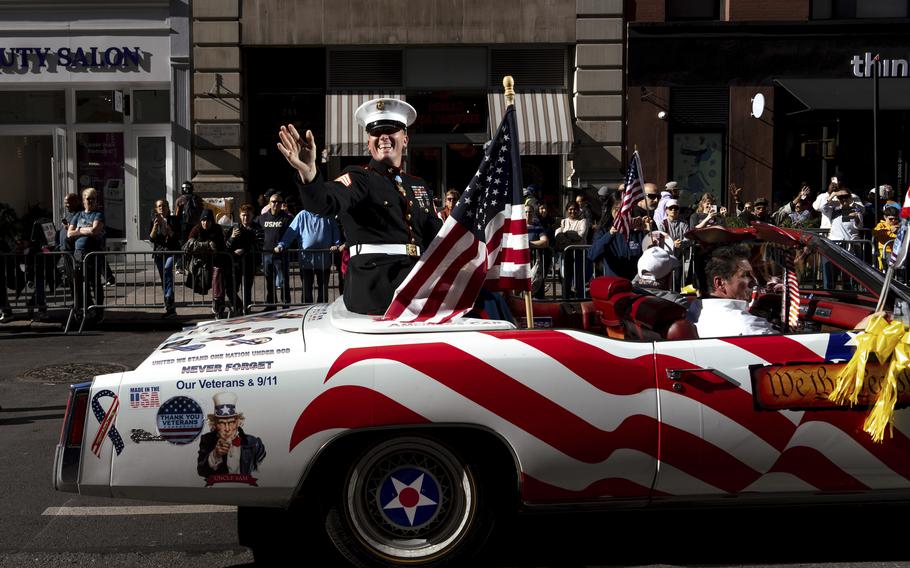 Grand Marshal Dakota Meyer, U.S. Marine Corps, a Medal of Honor recipient, waves from a car during the annual Veterans Day Parade, Monday, Nov. 11, 2024, in New York.