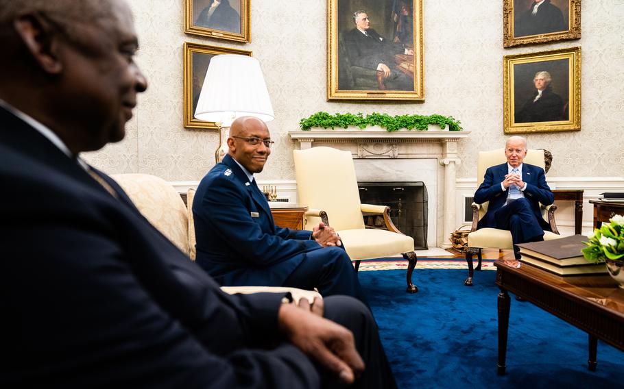 President Biden delivers remarks during a meeting with his national security team regarding Ukraine in the White House Oval Office on Thursday. Defense Department Secretary Lloyd Austin, on left, Joint Chiefs of Staff Chairman Charles Brown and others participated in the meeting. 