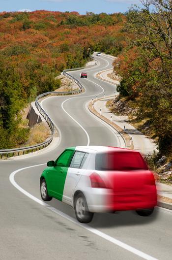 Traveling car in national flag of Italy colors and beautiful road landscape