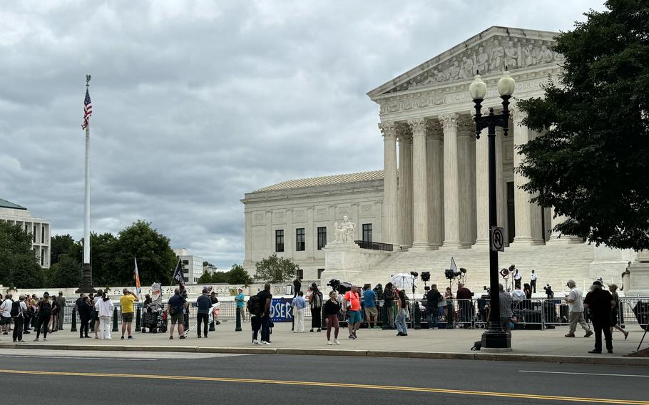 Spectators gather outside the Supreme Court in Washington on July 1, 2024.