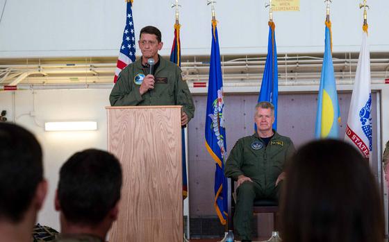 Rear Adm. Gregory Huffman delivers remarks near Adm. Samuel Paparo, head of U.S. Indo-Pacific Command, during the Joint Task Force–Micronesia assumption-of-command ceremony at Anderson Air Force Base, Guam, June 14, 2024.