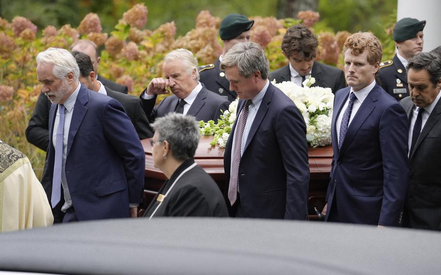 Pallbearers Max Kennedy, left, Chris Kennedy, behind center left, both sons of the late Ethel Kennedy, and Matt Kennedy, center front, and, Joseph Kennedy III, front second from right, both grandsons of Ethel Kennedy, carry her casket from Our Lady of Victory church, following funeral services, Monday, Oct. 14, 2024, in Centerville, Mass.