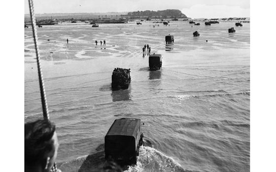 Allied troops disembark from landing crafts during D-Day 06 June 1944 after Allied forces stormed the Normandy beaches.   (-/AFP/Getty Images/TNS)