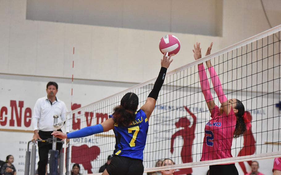 Sigonella's Nyeema Fernandez tips the ball towards the net and Aviano's Jazmyn Warren on Saturday, Oct. 5, 2024, at Aviano Air Base, Italy.