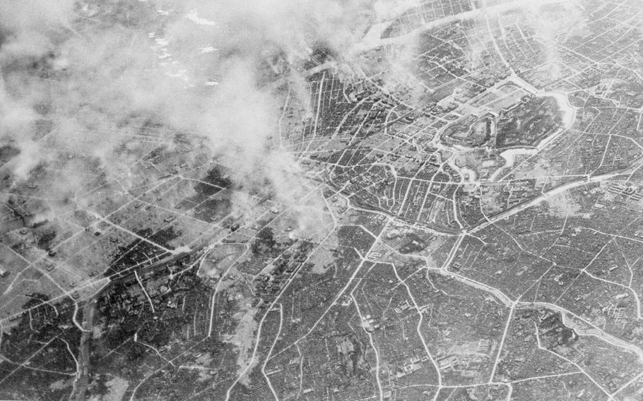 This black and white photo shows plumes of smoke rising from Tokyo.