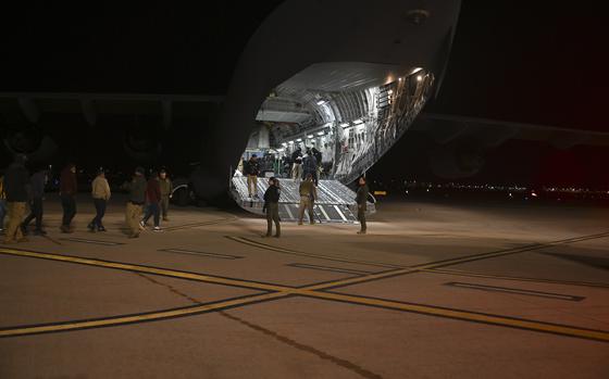 U.S. Customs and Border Protection members load illegal aliens on a C-17 Globemaster III at the Tucson International Airport, Ariz., Jan. 23, 2025. Under the direction of U.S. Northern Command, U.S. Transportation Command is supporting Immigration and Customs Enforcement removal flights by providing military airlift. (Dept. of Defense photo by TSgt Kimberly Nagle)