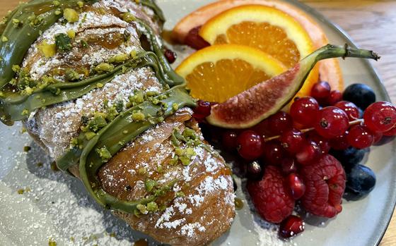 Sweet treats made with pistachio cream, including this croissant sprinkled with powdered sugar, are one of NEO Cafe Deli's specialties. Pistachio pancakes, with fruit and pistachio cream, are one of the most popular breakfast items on the menu, according to the owners.