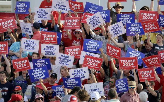 Supporters wave signs before former President Donald Trump speaks at a rally in Wilmington, N.C., Saturday, April 20, 2024. Trump never spoke, as the event was canceled because of threatening weather. (AP Photo/Chris Seward)