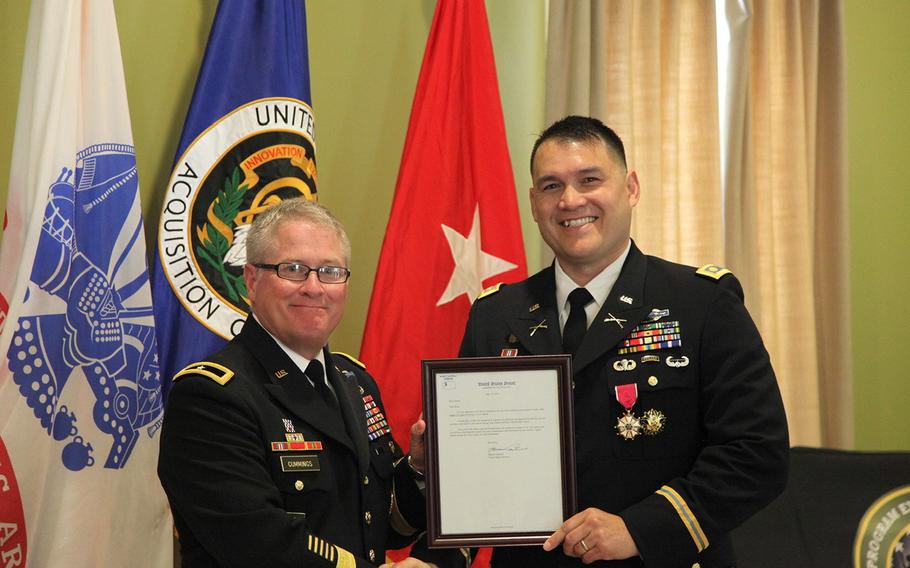 Ronald Schow with then-Brig. Gen. Brian Cummings at his retirement ceremony in October 2017. The Army made a clerical error when promoting Schow to major in 2006 and revoked his rank, forcing him to retire as a captain.