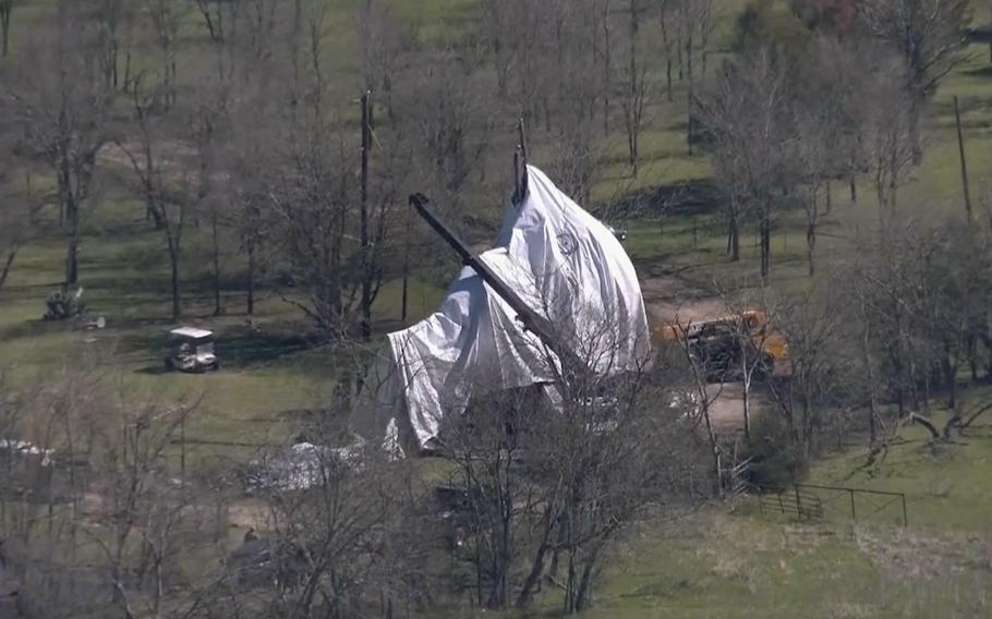 The deflated balloon crashed on a golf course.